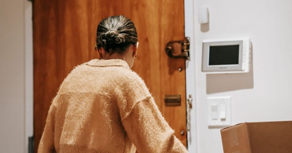 Woman receiving a laundry delivery at her front door - Laundry Pickup and Delivery in Chicago